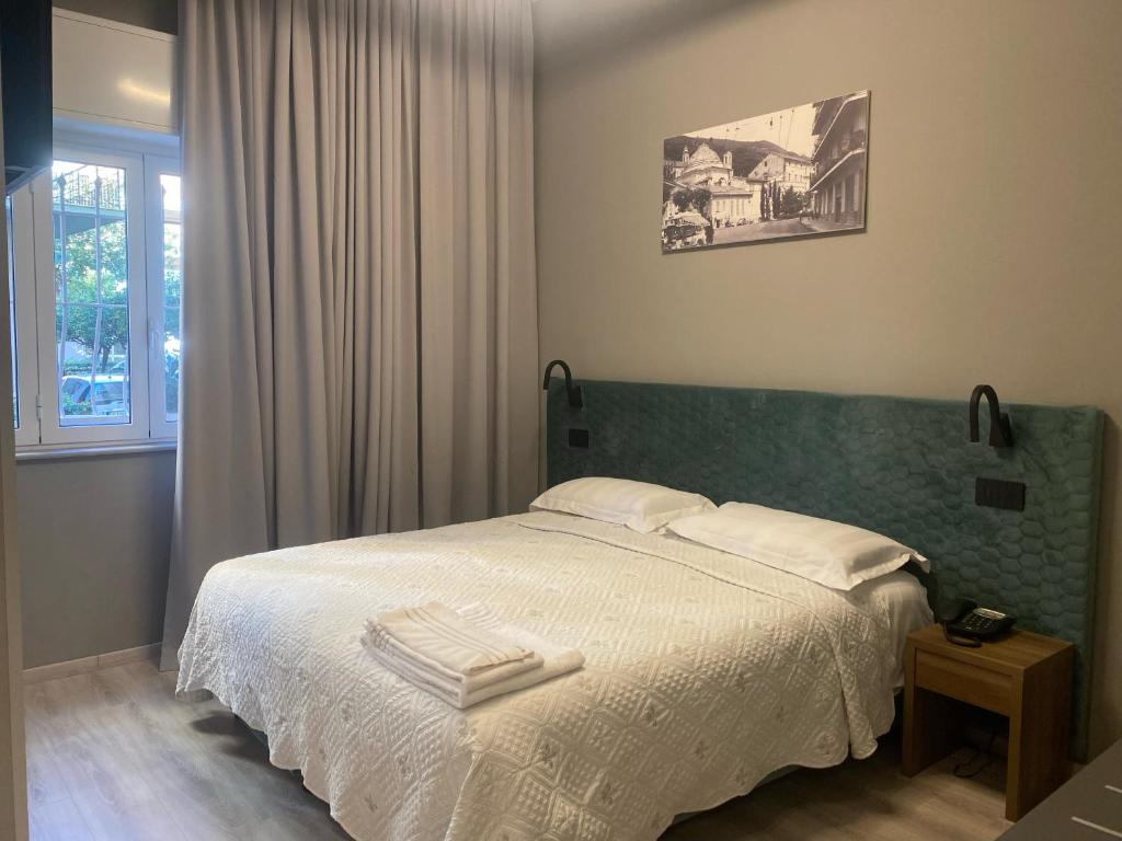 Кровать или кровати в номере Hotel Graziella
