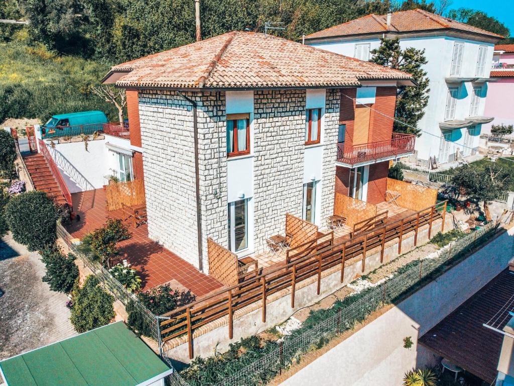 an overhead view of a house with a wooden fence at Onda del Conero in Numana