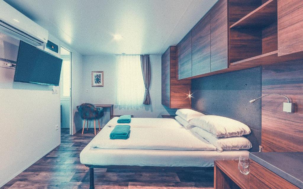 Postel nebo postele na pokoji v ubytování Club del Sole Tenuta Primero Hotel