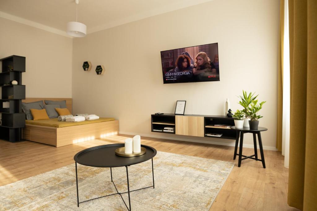 TV a/nebo společenská místnost v ubytování Square 2