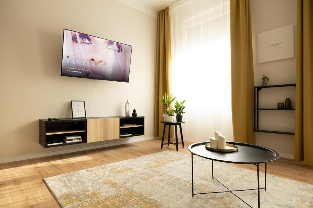 TV a/nebo společenská místnost v ubytování Square 2
