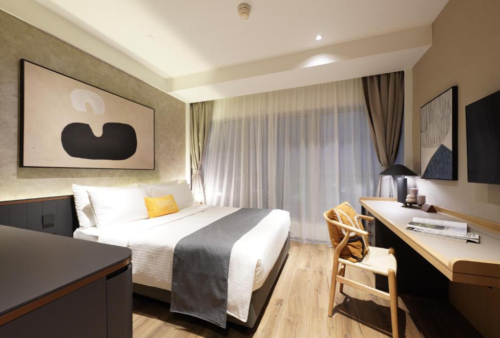 Letto o letti in una camera di Dash Living on Prat