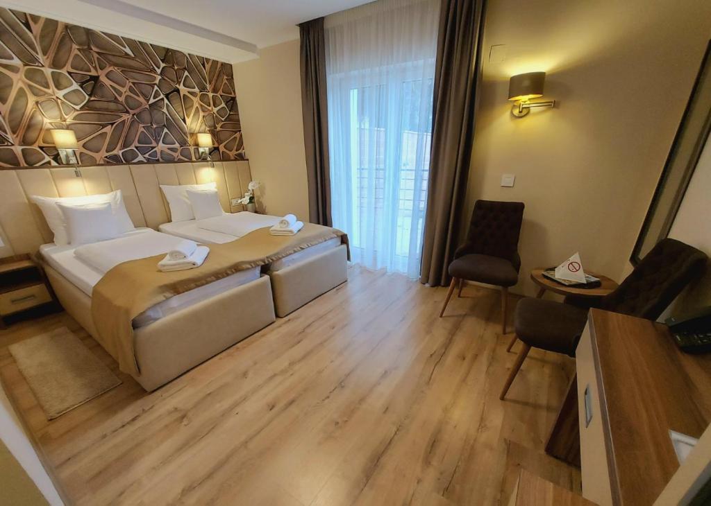 Postel nebo postele na pokoji v ubytování Papuli rooms 4U