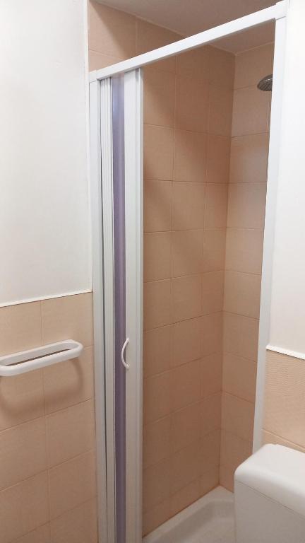 a shower with a glass door in a bathroom at Casa Vacanze La Cantinetta Via Montesanto in Peschici