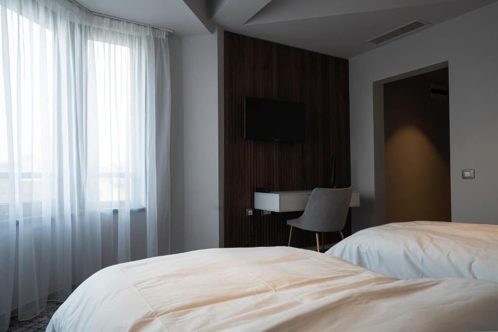 Postel nebo postele na pokoji v ubytování Hotel Cristal