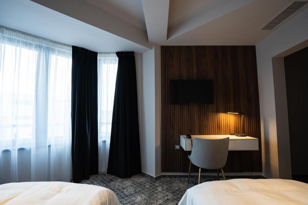 Postel nebo postele na pokoji v ubytování Hotel Cristal