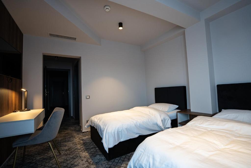 Postel nebo postele na pokoji v ubytování Hotel Cristal
