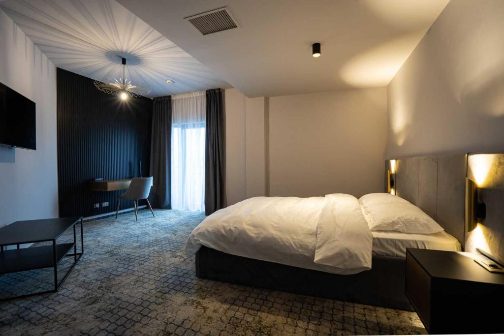Postel nebo postele na pokoji v ubytování Hotel Cristal