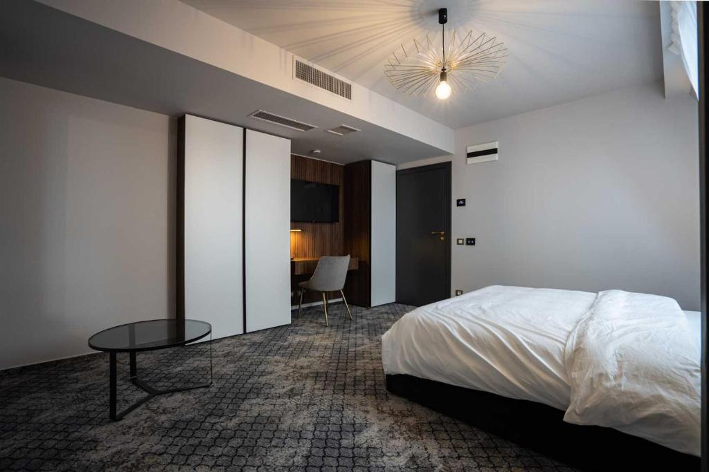 Postel nebo postele na pokoji v ubytování Hotel Cristal