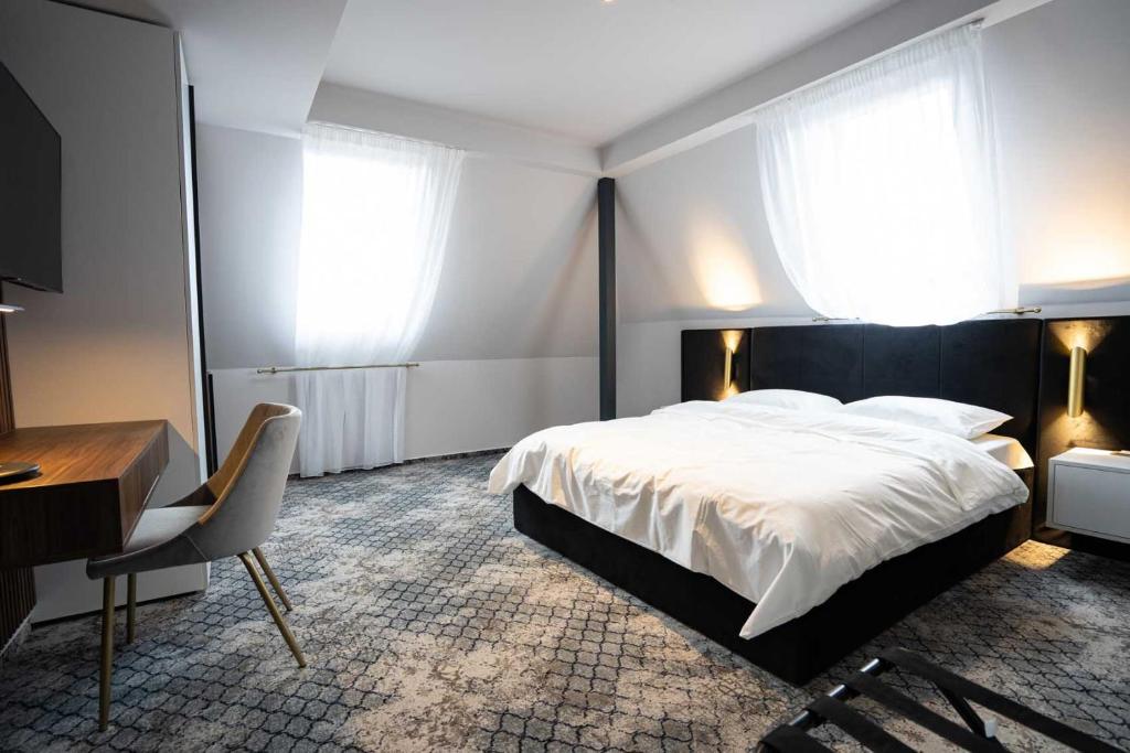 Postel nebo postele na pokoji v ubytování Hotel Cristal