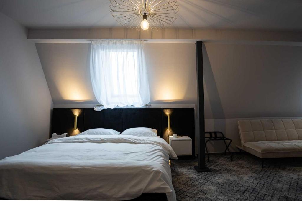 Postel nebo postele na pokoji v ubytování Hotel Cristal