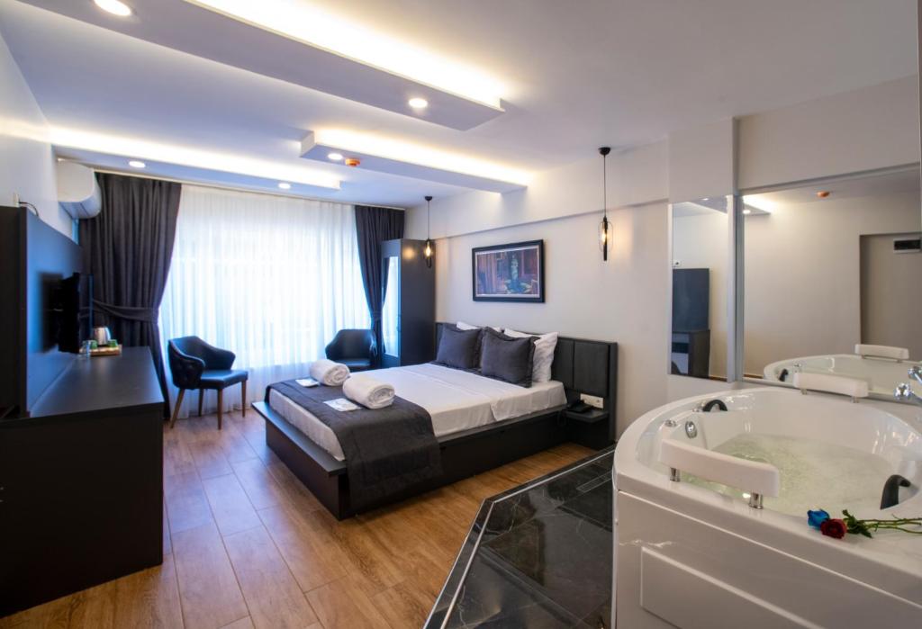A bed or beds in a room at Kanarya Suite