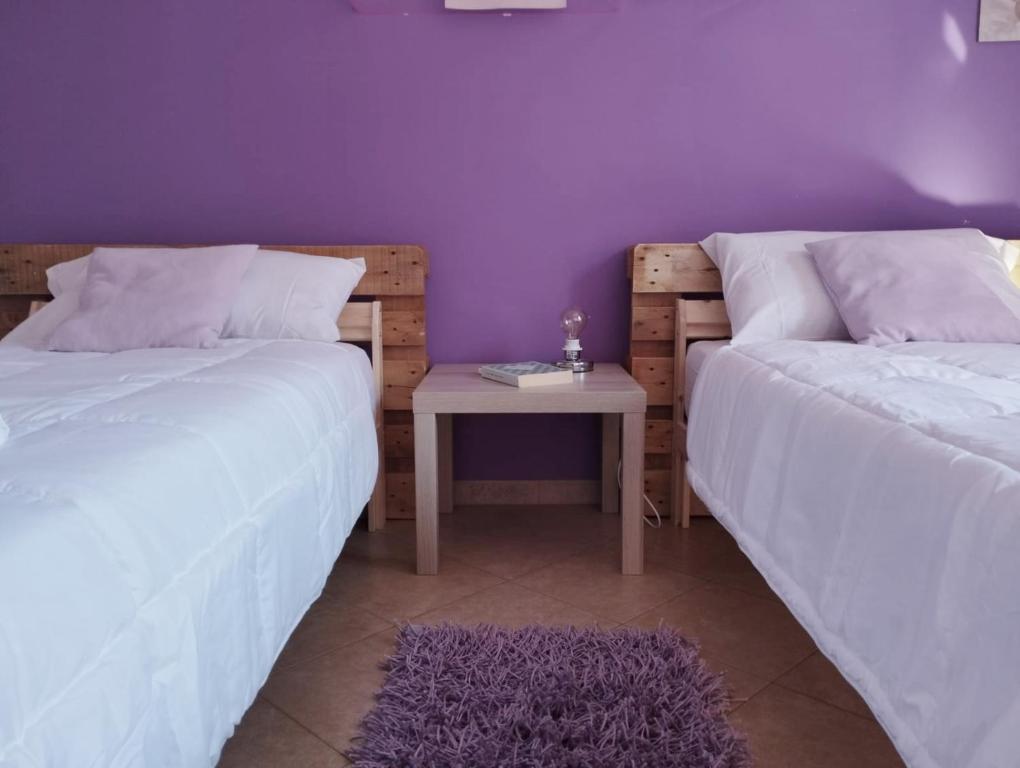 Postel nebo postele na pokoji v ubytování Ferula loft