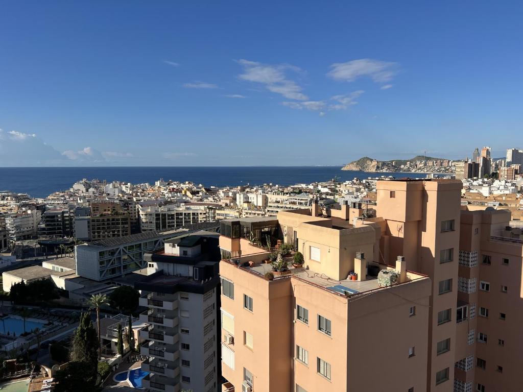 a view of a city with buildings and the ocean at Acacias IV 15A in Benidorm