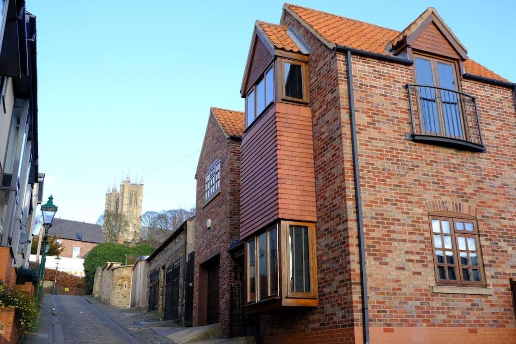 an old brick building with windows on a street at 16 St Martins near to Steep Hill in Lincoln