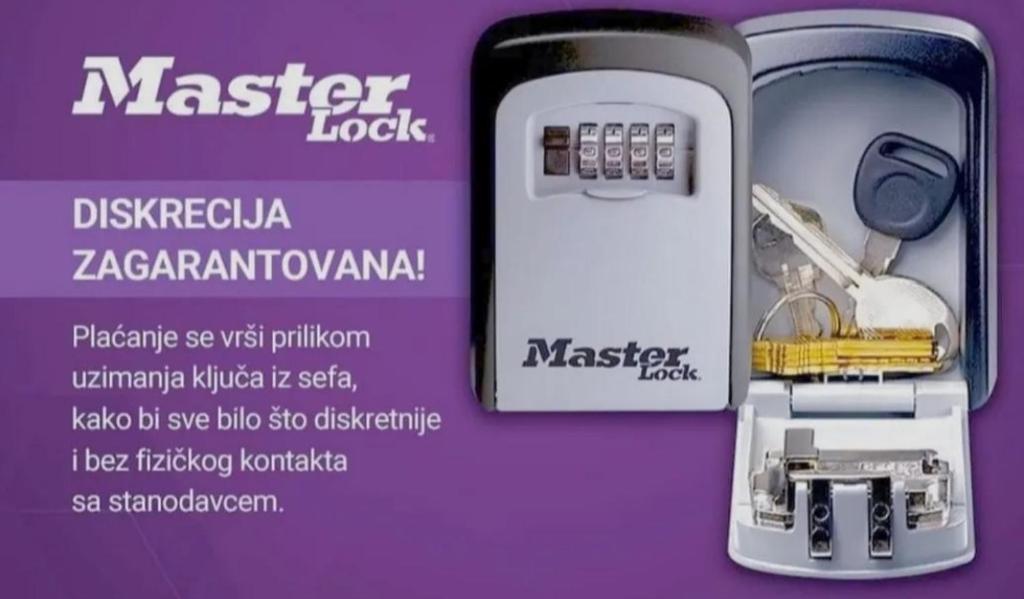 a advertisement for a cell phone with a key in a case at Stan na dan Zvornik in Zvornik