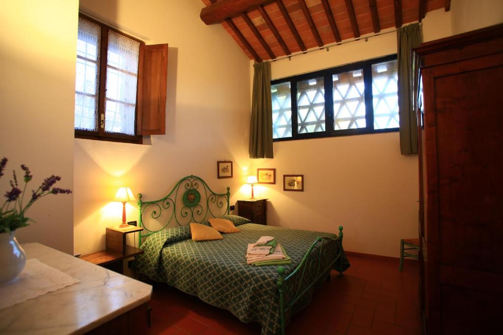 Postel nebo postele na pokoji v ubytování Relais Antico Borgo San Lorenzo