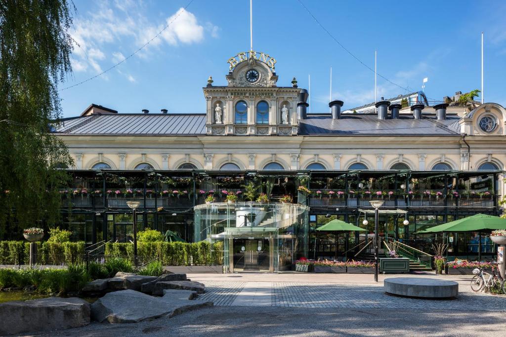 a large building with a clock tower on top of it at Berns, Historical Boutique Hotel & House of Entertainment since 1863 in Stockholm