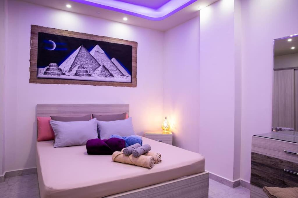 Кровать или кровати в номере F&M Home Egypt - Apartment Hurghada
