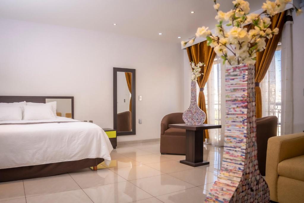Postel nebo postele na pokoji v ubytování Hotel SanJo