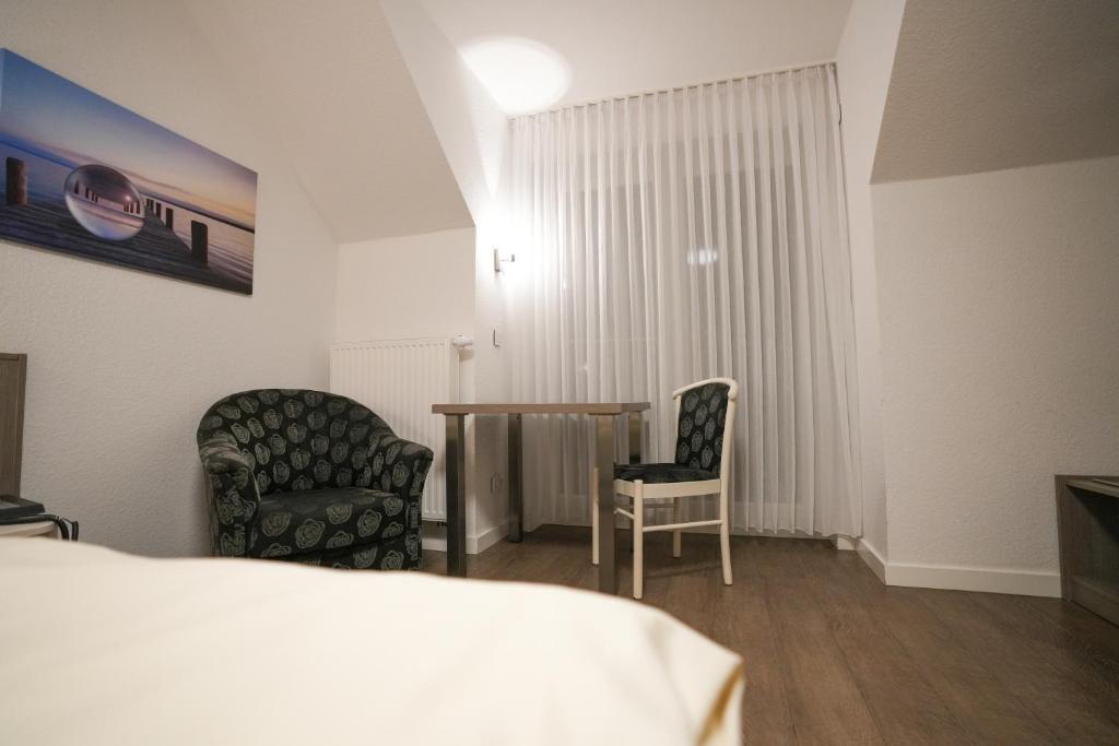 Postel nebo postele na pokoji v ubytování Hotel Lingemann