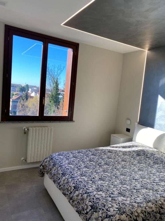 Postel nebo postele na pokoji v ubytování La Casa di Davide Milano Monza