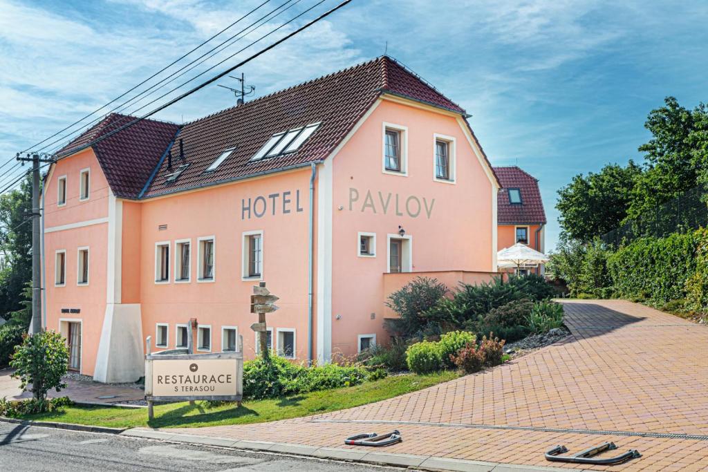 a large pink building with the words hotel playlay at Hotel Pavlov in Pavlov