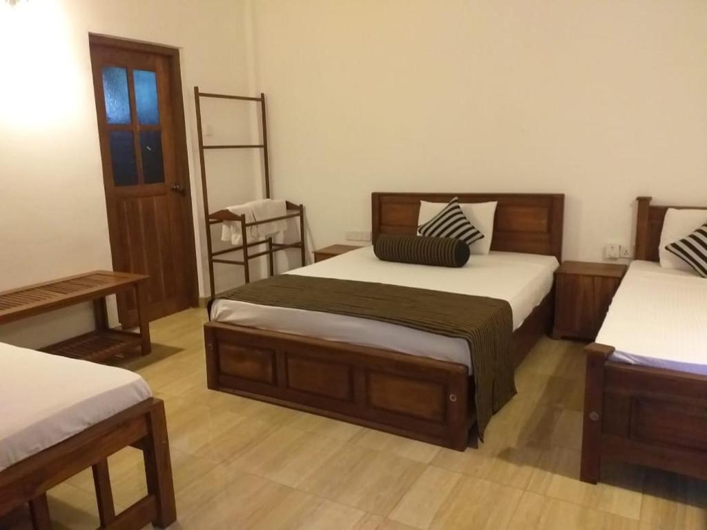 Postel nebo postele na pokoji v ubytování Isanka Lion Lodge