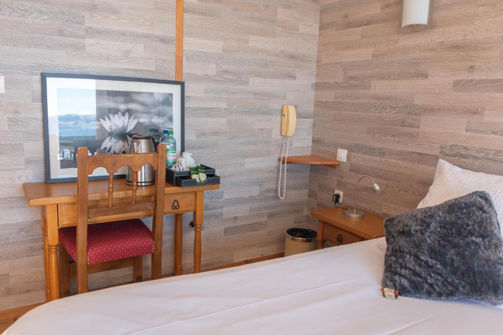 Postel nebo postele na pokoji v ubytování Hotel des Pyrénées