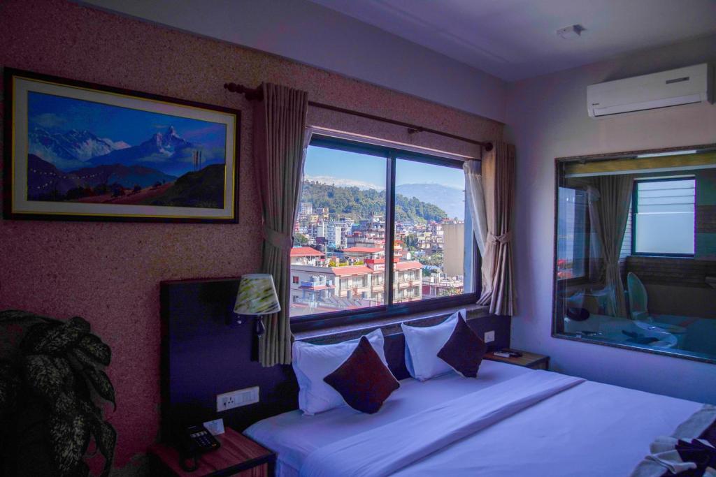 Giường trong phòng chung tại Hotel Shaara