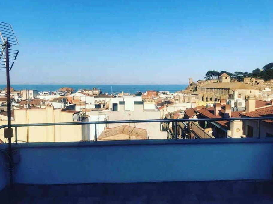 a view of a city from a balcony at Joli appartement centre avec terrasse vue mer in Tossa de Mar