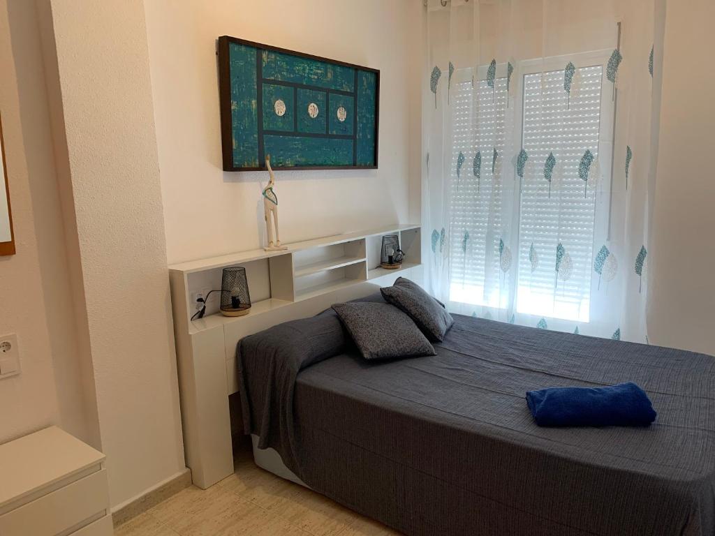 Posteľ alebo postele v izbe v ubytovaní TORREVIEJA Apartamento