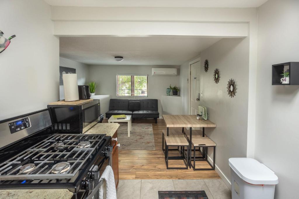 a kitchen and living room with a stove at Spacious Guest Suite Amazing Location in San Diego