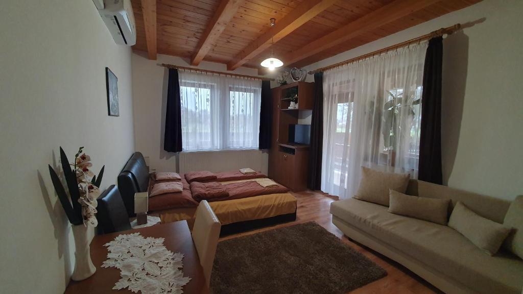 Postel nebo postele na pokoji v ubytování Kékszilva Vendégház