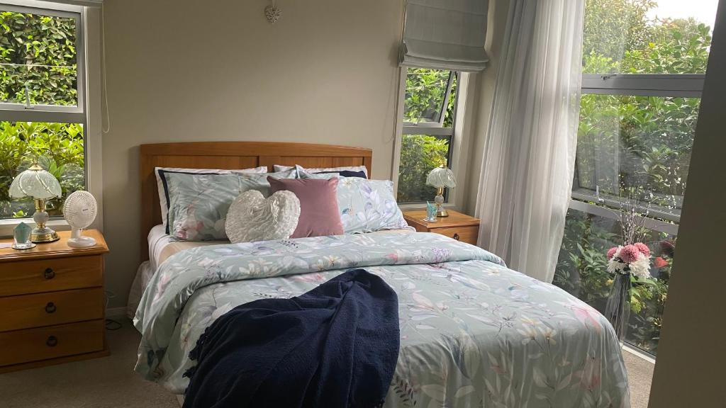 a bedroom with a bed and a window at Nottinghill B n B in Blenheim