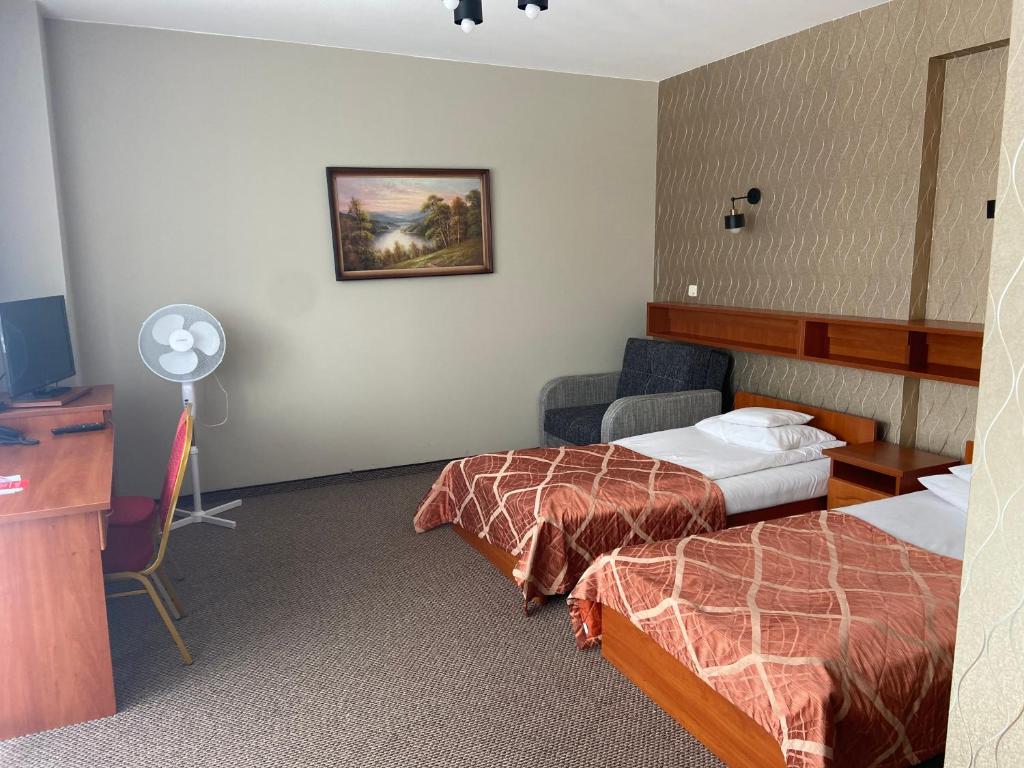 Postel nebo postele na pokoji v ubytování Hotel i Restauracja Bona