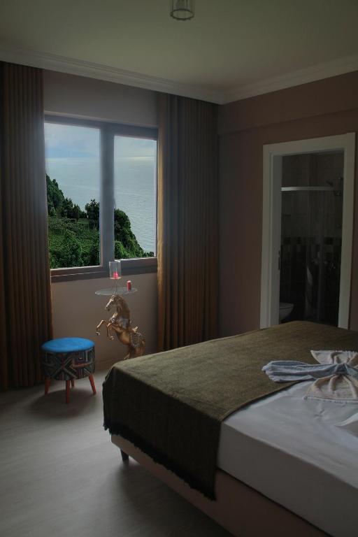 Postel nebo postele na pokoji v ubytování AKDAĞ KEMER OTEL