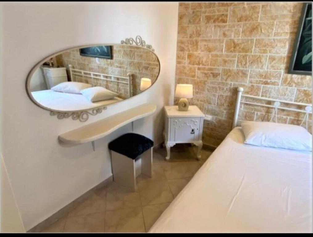 A bed or beds in a room at Traditional house in Corfu, kouramades vlg