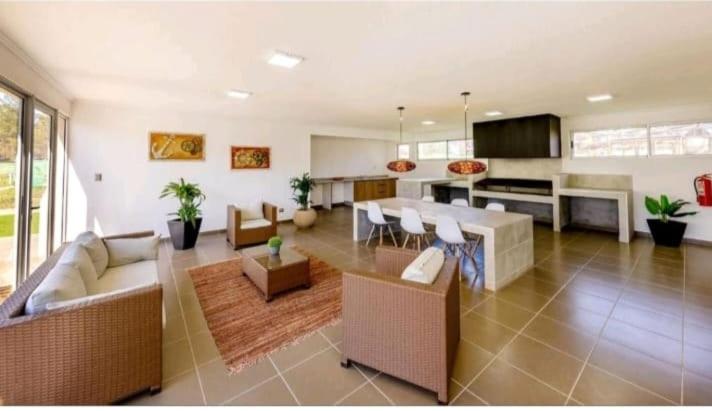 a large living room with couches and a kitchen at ¡¡Disfruta En Parquemar El Tabo!! in El Tabo