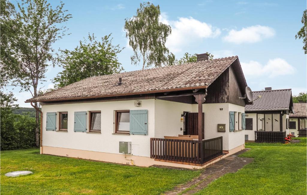 a white house with a brown roof at Ferienhaus 21 In Thalfang in Thalfang