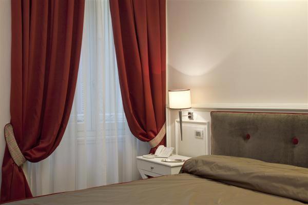 Postel nebo postele na pokoji v ubytování Hotel Patria