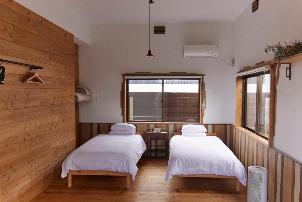 Tempat tidur dalam kamar di Private House NINUFA