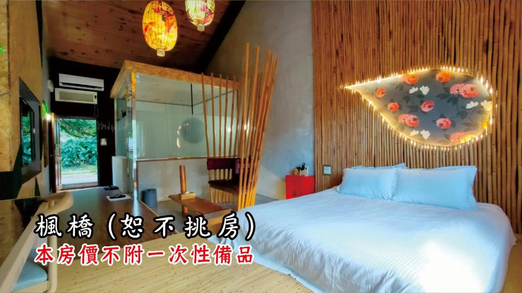 a bedroom with a large bed in a room at Tingtau Villa in Lugu Lake