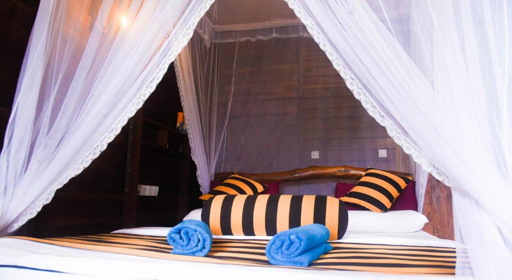 Postel nebo postele na pokoji v ubytování Madushanka Resort
