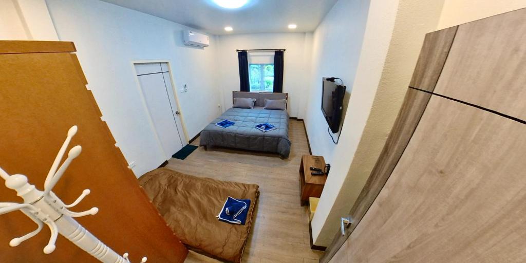 Postel nebo postele na pokoji v ubytování TRIPLE TWO HOUSE