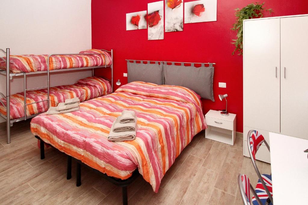 Postel nebo postele na pokoji v ubytování B&B Il Rosso e il Blu