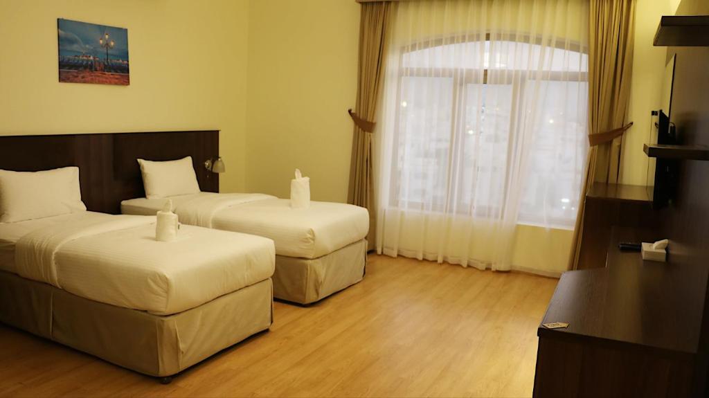 Postel nebo postele na pokoji v ubytování Weekdays Hotel