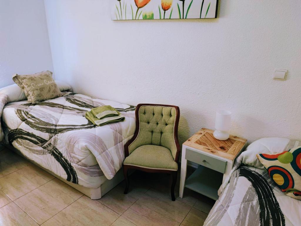 A bed or beds in a room at Apartamento La flor de Mayo