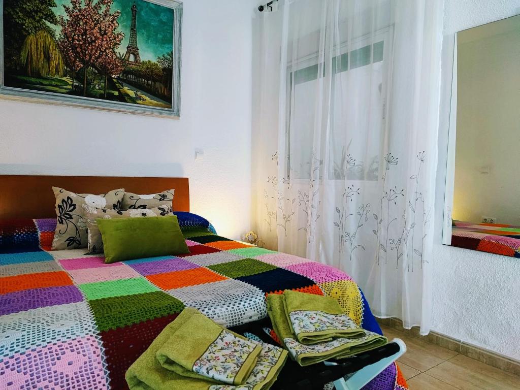 A bed or beds in a room at Apartamento La flor de Mayo