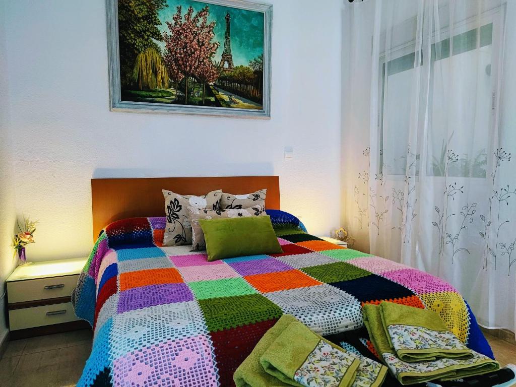 A bed or beds in a room at Apartamento La flor de Mayo